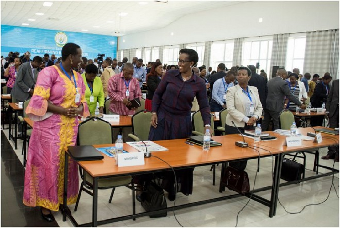 First Lady Jeannette Kagame discussing with Hon. Julienne Uwacu - Minister of Sports and Culture - at the 13th National Leadership Retreat in Gabiro