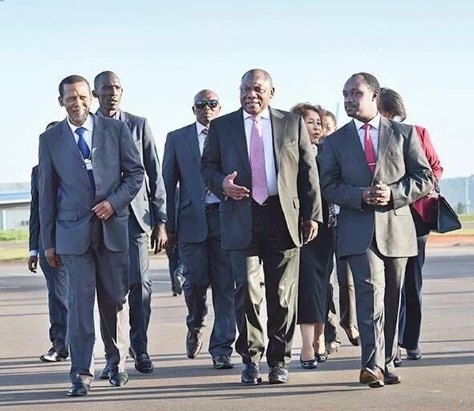 South African Deputy President Cyril Ramaphosa (front-center) arrives at Kigali International airport for the WEF. He was received by Rwanda's Mines State Minister Evode Imena (right)