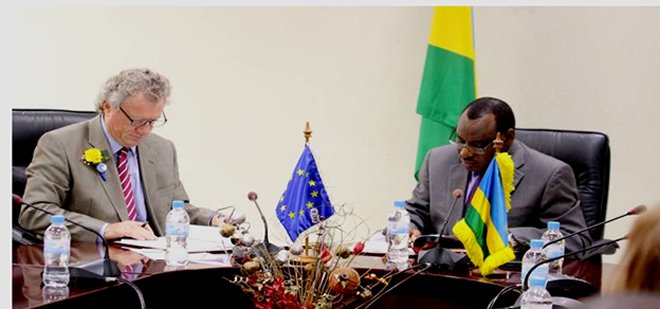 EU envoy to Rwanda Michael Ryan and Rwanda's Finance Minister Claver Gatete signing