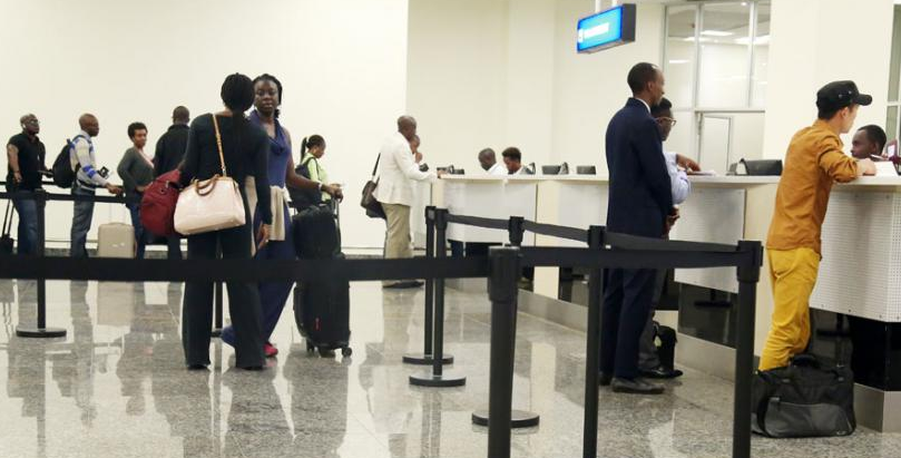 Travelers check-in at Kigali International Airport. Rwanda will begin issuing the Africa Common passport