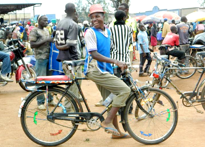 A bicycle taxi operator waiting for clients 