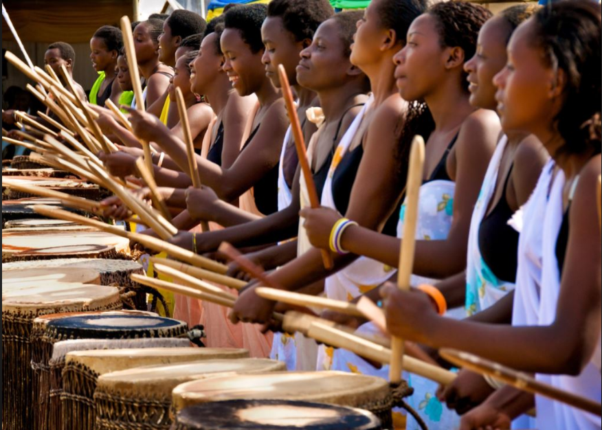 Rwanda women drumming rhythmically 