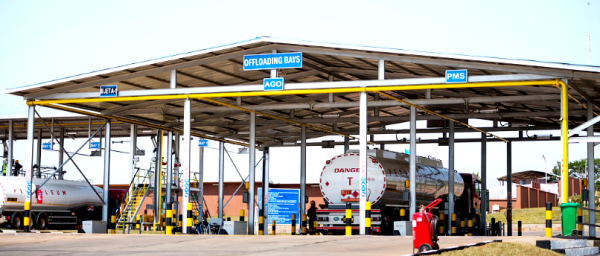 Trucks offloading fuel at depot 