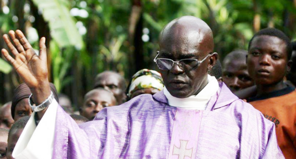 Fr.Ubald Rugirangoga during mass prayer